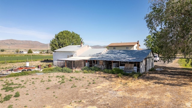 10205 W 10400 N, Tremonton, UT 84337 - rear view of property featuring a mountain view and metal roof