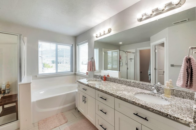 945 W Mckenna Rd, Bluffdale, UT 84065 - bathroom with a stall shower, double vanity, a garden tub, and tile patterned floors