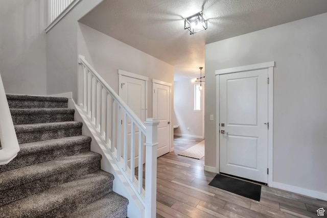 945 W Mckenna Rd, Bluffdale, UT 84065 - staircase with wood finished floors and baseboards
