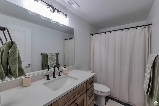 945 W Mckenna Rd, Bluffdale, UT 84065 - bathroom with toilet, vanity, and tile patterned flooring