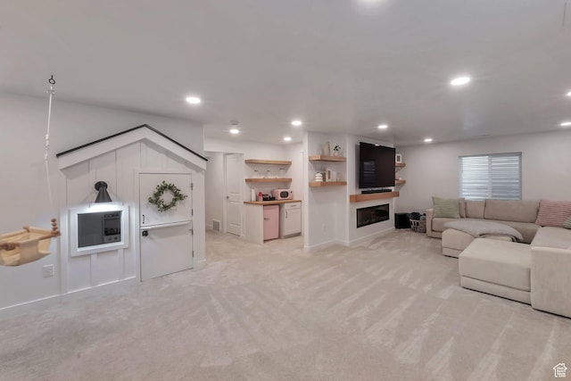 945 W Mckenna Rd, Bluffdale, UT 84065 - living area with light colored carpet, a glass covered fireplace, and recessed lighting