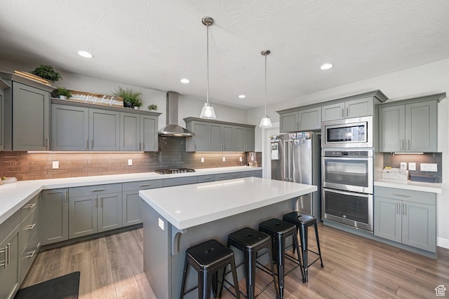 149 E 230 N, Vineyard, UT 84059 - kitchen with wall chimney range hood, stainless steel appliances, gray cabinets, backsplash, and recessed lighting