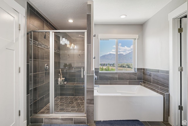149 E 230 N, Vineyard, UT 84059 - bathroom featuring a garden tub, a shower stall, recessed lighting, a mountain view, and tile patterned flooring