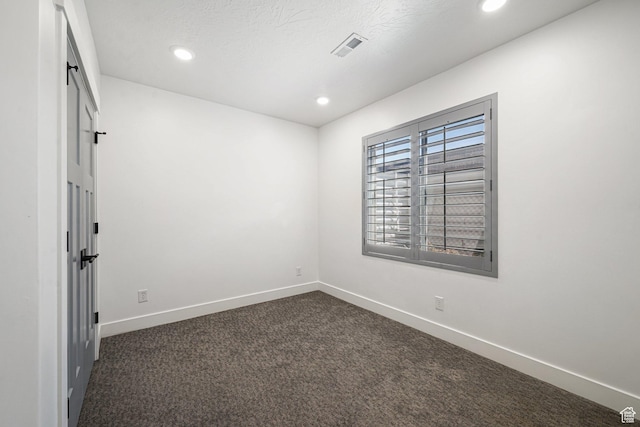 149 E 230 N, Vineyard, UT 84059 - unfurnished room featuring dark colored carpet, baseboards, and recessed lighting
