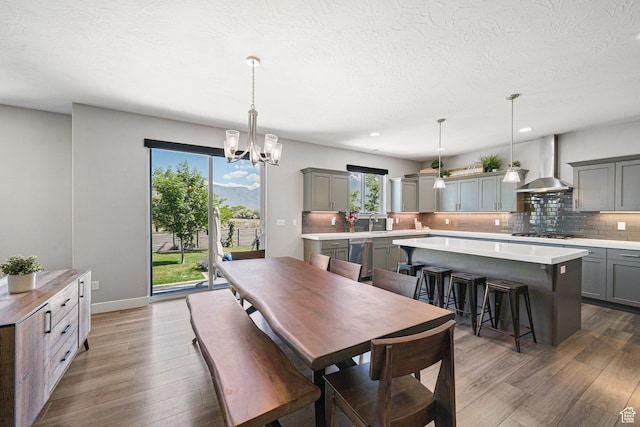 149 E 230 N, Vineyard, UT 84059 - dining space with wood finished floors, a chandelier, a textured ceiling, recessed lighting, and baseboards