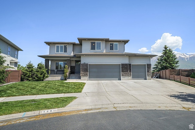149 E 230 N, Vineyard, UT 84059 - prairie-style house with driveway, stone siding, and an attached garage
