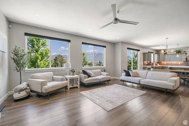 149 E 230 N, Vineyard, UT 84059 - living area with a chandelier, a ceiling fan, recessed lighting, wood finished floors, and baseboards