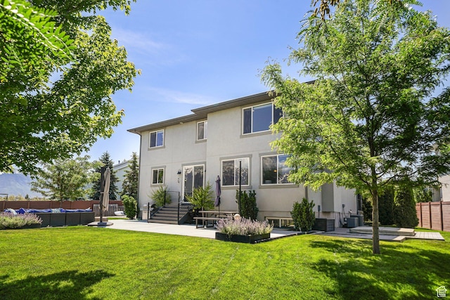 149 E 230 N, Vineyard, UT 84059 - rear view of property with stucco siding, central AC unit, and a patio