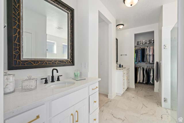 648 W 400 N, Mapleton, UT 84664 - full bath with baseboards, vanity, marble finish floors, and a spacious closet