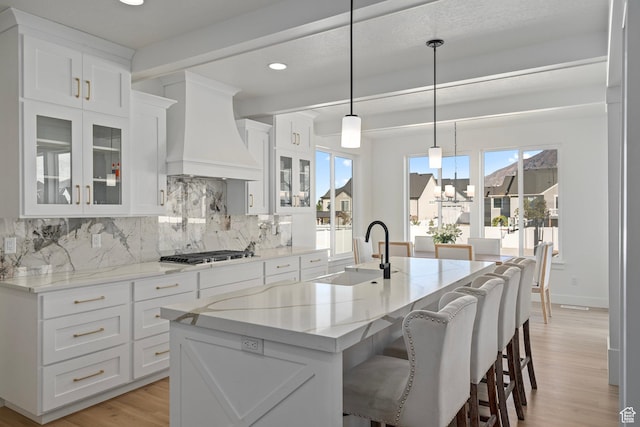 648 W 400 N, Mapleton, UT 84664 - kitchen featuring a sink, premium range hood, gas cooktop, a chandelier, and light wood-style flooring