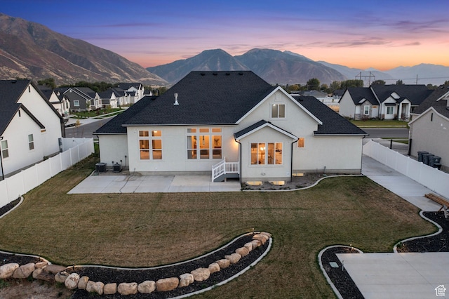648 W 400 N, Mapleton, UT 84664 - back of property at dusk with a mountain view, a patio, a residential view, and a shingled roof