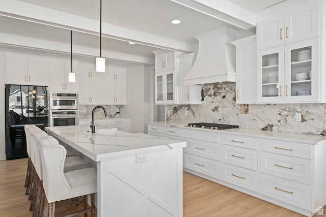 648 W 400 N, Mapleton, UT 84664 - kitchen with premium range hood, a sink, appliances with stainless steel finishes, backsplash, and white cabinetry