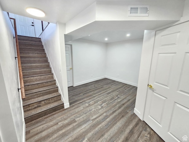 8181 W Danbury Dr, Magna, UT 84044 - finished below grade area with wood finished floors, stairs, baseboards, and recessed lighting