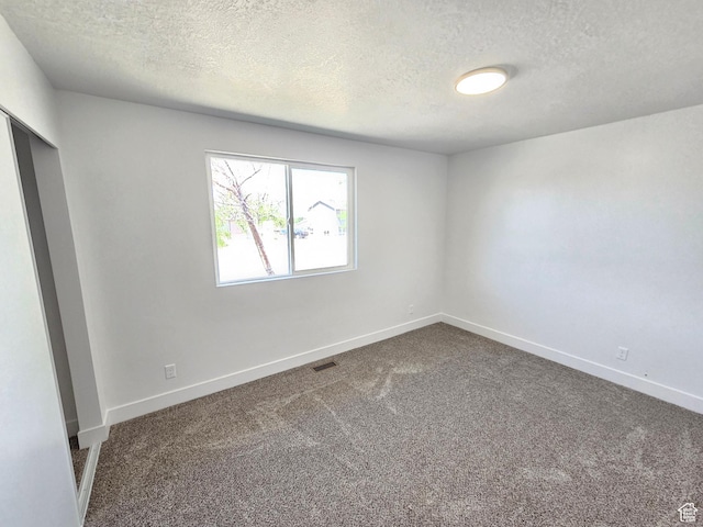 8181 W Danbury Dr, Magna, UT 84044 - carpeted empty room featuring a textured ceiling and baseboards
