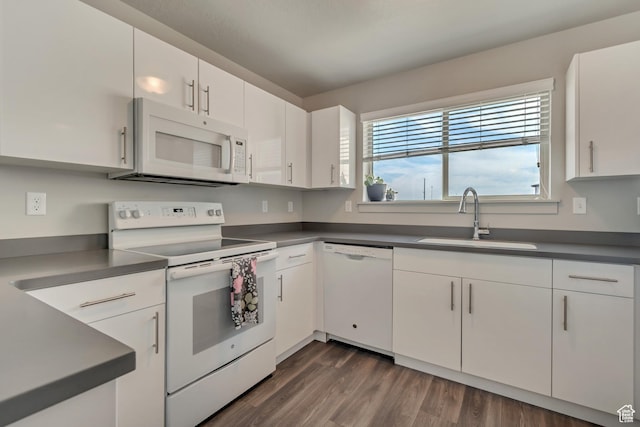 1700 Sandhill Rd Unit H301, Orem, UT 84058 - kitchen with white appliances, a sink, dark countertops, and white cabinets