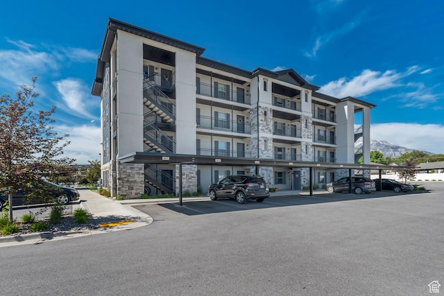 1700 Sandhill Rd Unit H301, Orem, UT 84058 - view of apartment building / complex featuring covered parking