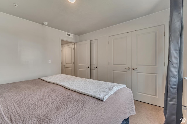 1700 Sandhill Rd Unit H301, Orem, UT 84058 - bedroom featuring light colored carpet and multiple closets