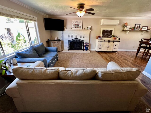 130 Cascade Quey St, Soda Springs, ID 83276 - living area featuring a wall mounted air conditioner, a ceiling fan, ornamental molding, a brick fireplace, and baseboards