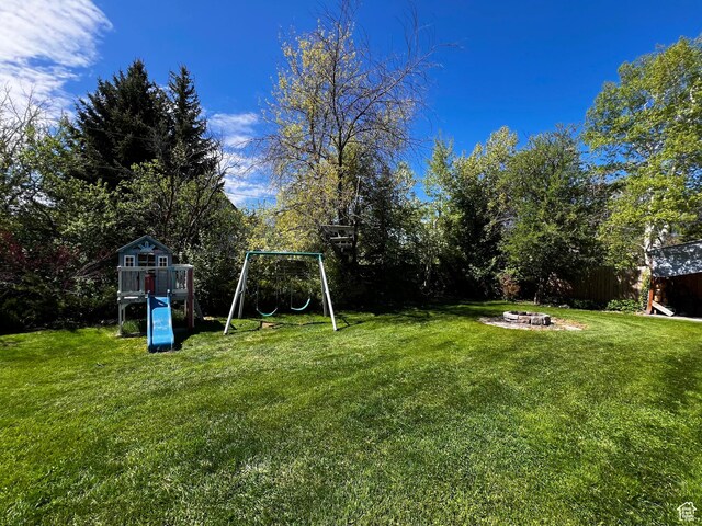 130 Cascade Quey St, Soda Springs, ID 83276 - view of yard featuring a playground and a fire pit
