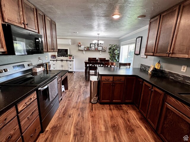 130 Cascade Quey St, Soda Springs, ID 83276 - kitchen featuring black microwave, stainless steel electric range oven, dark countertops, dark wood-style floors, and crown molding