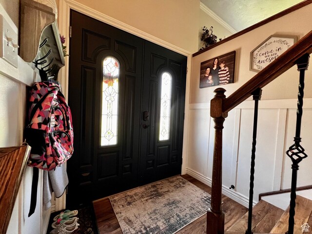 130 Cascade Quey St, Soda Springs, ID 83276 - entrance foyer with a decorative wall, wood finished floors, crown molding, and wainscoting