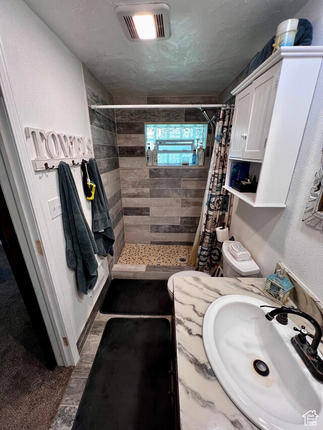 130 Cascade Quey St, Soda Springs, ID 83276 - full bathroom with a shower stall, vanity, and toilet