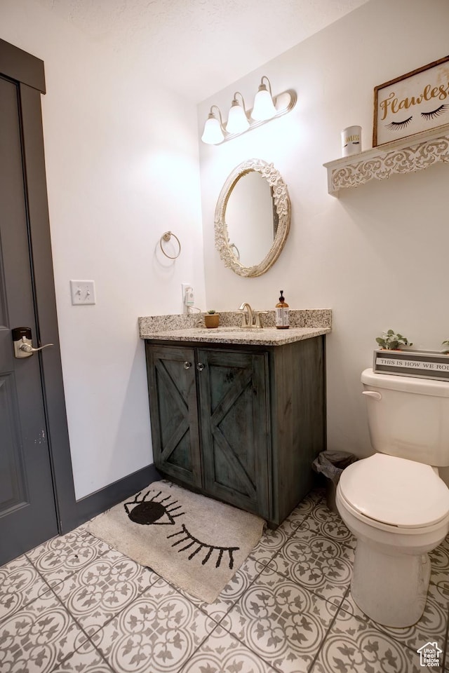 343 W Deer Creek Trl, Salem, UT 84653 - half bathroom featuring vanity, toilet, tile patterned flooring, and baseboards