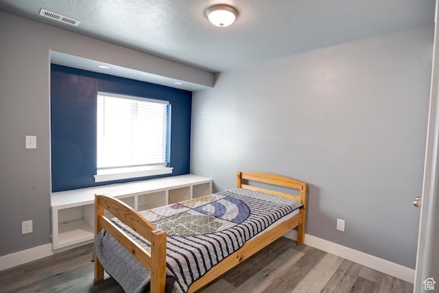 343 W Deer Creek Trl, Salem, UT 84653 - bedroom featuring wood finished floors and baseboards