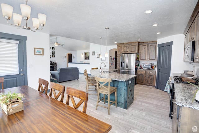 343 W Deer Creek Trl, Salem, UT 84653 - dining space featuring a textured ceiling, a chandelier, ceiling fan, light wood-style flooring, and recessed lighting