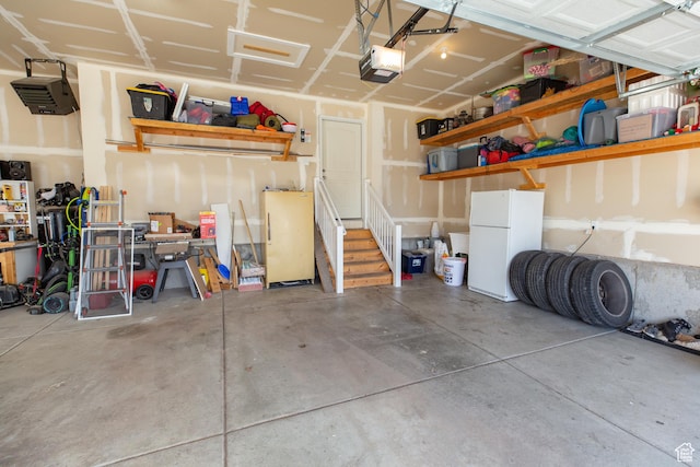 343 W Deer Creek Trl, Salem, UT 84653 - garage with freestanding refrigerator and a garage door opener