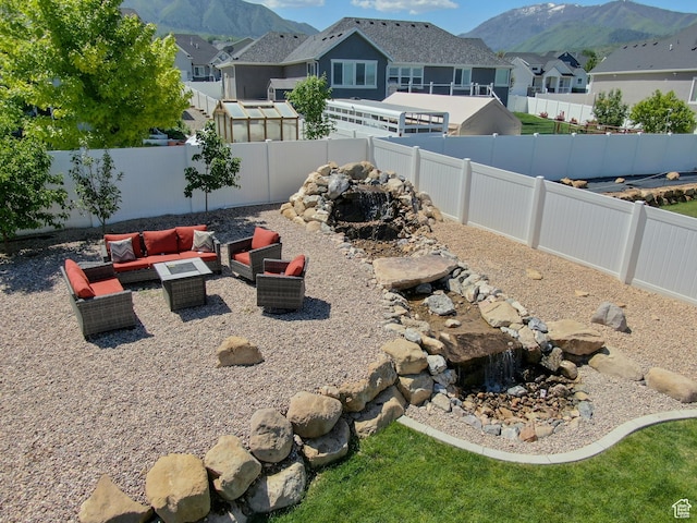 343 W Deer Creek Trl, Salem, UT 84653 - fenced backyard featuring a mountain view, a residential view, and an outdoor hangout area