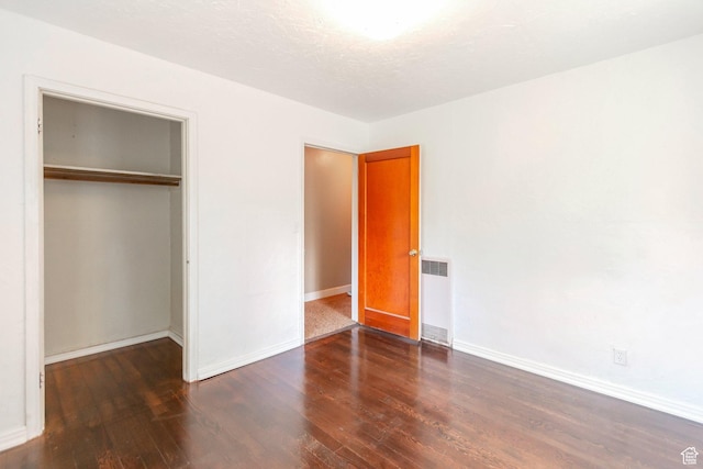 1463 E 12300 N, Cove, UT 84320 - unfurnished bedroom with radiator, wood finished floors, a closet, and baseboards