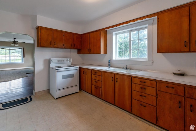 1463 E 12300 N, Cove, UT 84320 - kitchen with white electric stove, brown cabinetry, light countertops, and ceiling fan