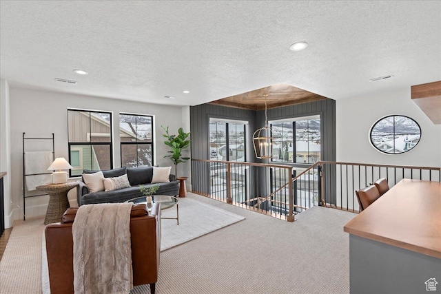 3651 N 200 E, North Ogden, UT 84414 - carpeted living room with a textured ceiling, healthy amount of natural light, and recessed lighting
