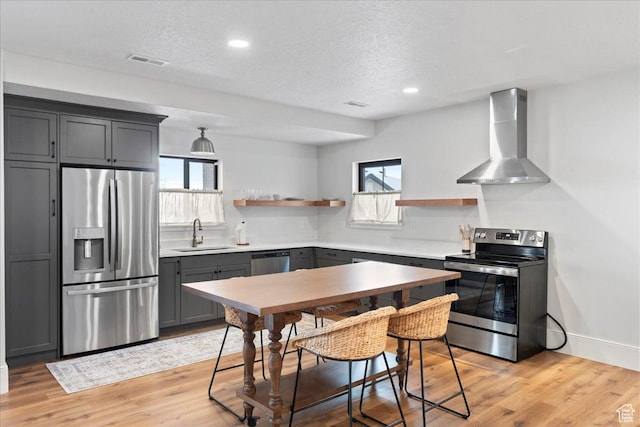 3651 N 200 E, North Ogden, UT 84414 - kitchen featuring appliances with stainless steel finishes, wall chimney range hood, open shelves, a sink, and plenty of natural light