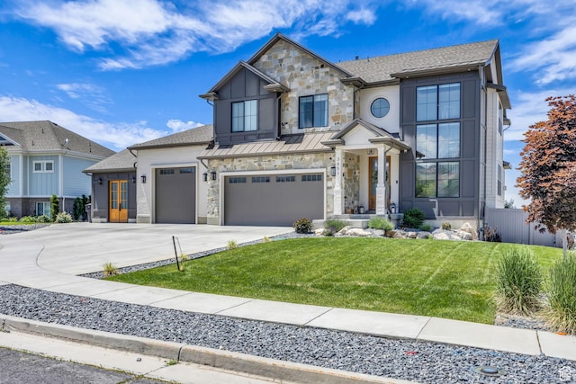 3651 N 200 E, North Ogden, UT 84414 - contemporary house featuring concrete driveway, stone siding, an attached garage, and a standing seam roof