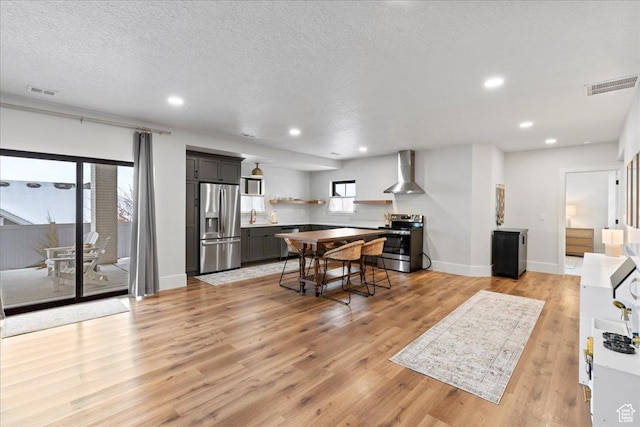 3651 N 200 E, North Ogden, UT 84414 - dining space featuring light wood-type flooring, recessed lighting, a textured ceiling, and baseboards