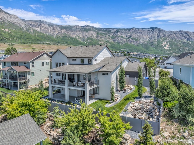 3651 N 200 E, North Ogden, UT 84414 - back of property with a fenced backyard, a patio area, a residential view, and a deck with mountain view