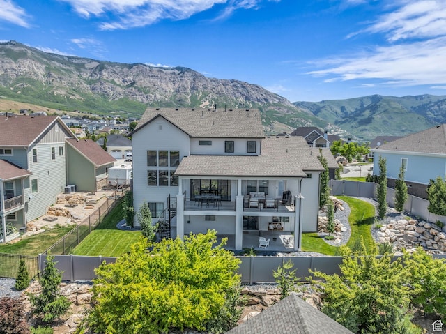 3651 N 200 E, North Ogden, UT 84414 - back of property with a residential view, a mountain view, a fenced backyard, roof with shingles, and stairway