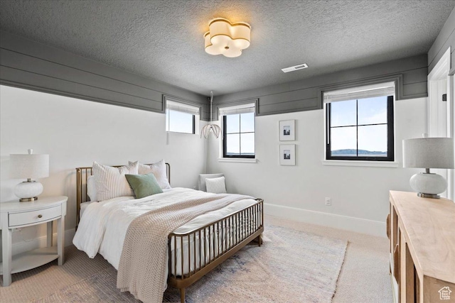 3651 N 200 E, North Ogden, UT 84414 - carpeted bedroom with a textured ceiling and baseboards