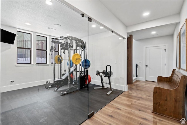 3651 N 200 E, North Ogden, UT 84414 - exercise room featuring baseboards, wood finished floors, recessed lighting, and a textured ceiling