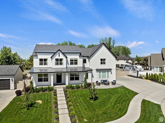 325 N 1200 E, American Fork, UT 84003 - modern farmhouse style home featuring a standing seam roof, concrete driveway, a porch, and metal roof