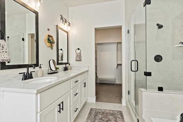 325 N 1200 E, American Fork, UT 84003 - full bathroom featuring tile patterned floors, a shower stall, double vanity, and a spacious closet