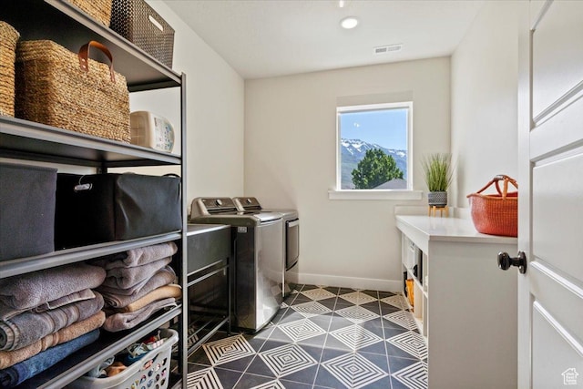 325 N 1200 E, American Fork, UT 84003 - washroom with baseboards, independent washer and dryer, and dark tile patterned flooring