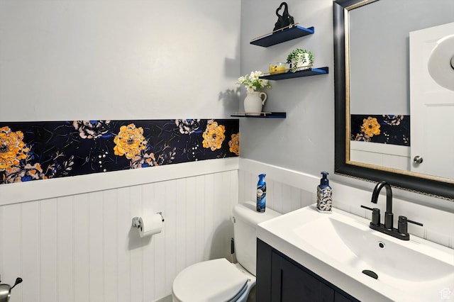 5186 W Hedgerose Dr S, Herriman, UT 84096 - half bathroom with a wainscoted wall, vanity, and toilet