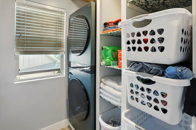 5186 W Hedgerose Dr S, Herriman, UT 84096 - laundry room featuring stacked washer and clothes dryer and baseboards