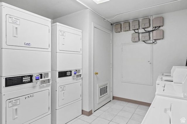 1860 W 500 N Unit 7, Salt Lake City, UT 84116 - community laundry room featuring estacked washer and dryer, baseboards, and light tile patterned floors