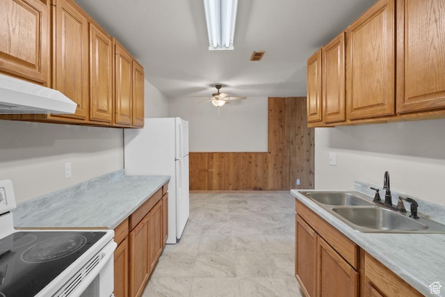 1860 W 500 N Unit 7, Salt Lake City, UT 84116 - kitchen with white appliances, a sink, wood walls, a ceiling fan, and under cabinet range hood