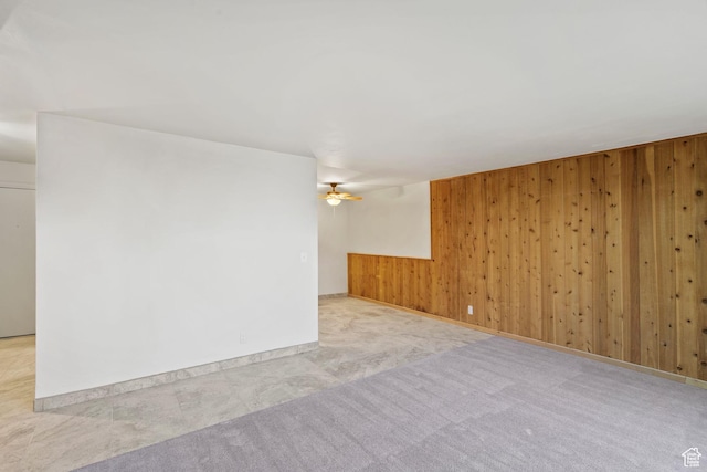 1860 W 500 N Unit 7, Salt Lake City, UT 84116 - carpeted spare room featuring wooden walls, a ceiling fan, and baseboards