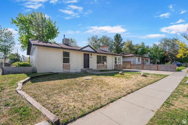 4589 S Trojan Dr, West Valley City, UT 84120 - ranch-style home featuring brick siding, a chimney, and central AC